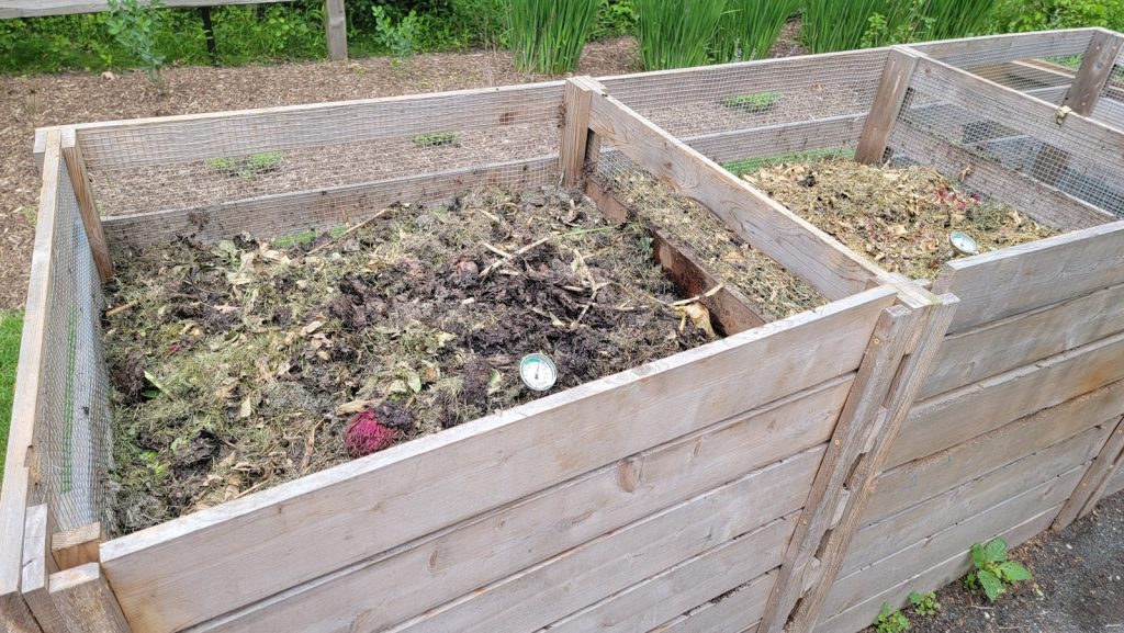 a couple of wooden boxes filled with dirt